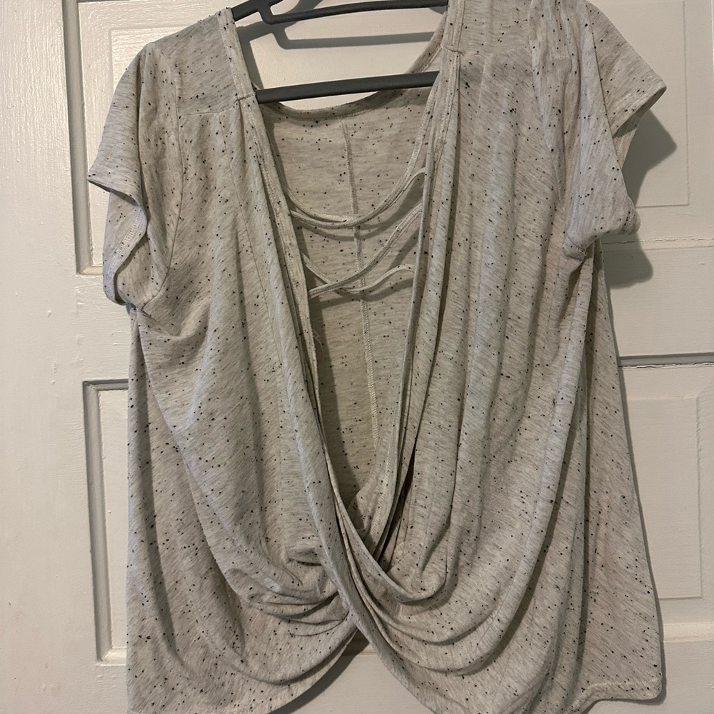 Poof brand great t shirt. Cut out back detailing.